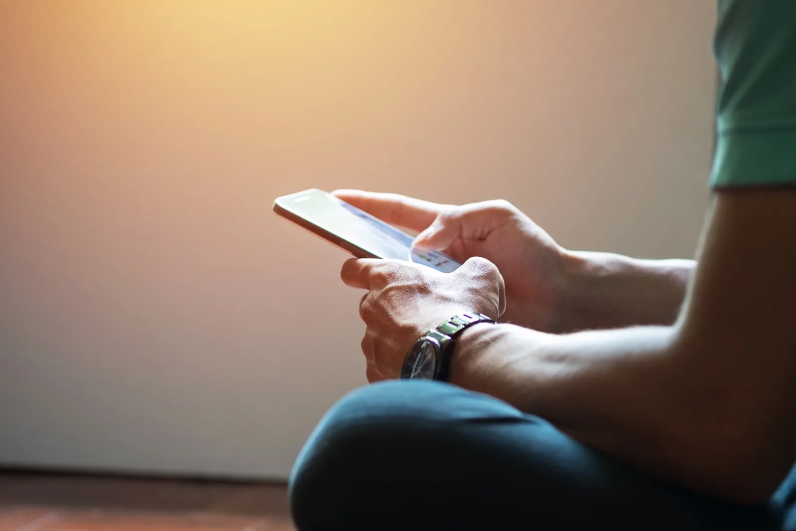 A person typing on their phone